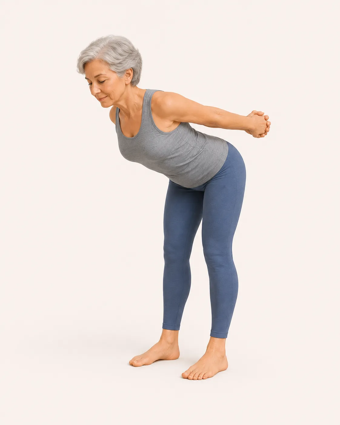 Senior hinging forward from the hips in the Makko-Ho forward fold to stretch the Lung and Large Intestine meridians