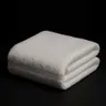 Soft cotton household towel used for Japanese neck stretching exercises - the only equipment needed